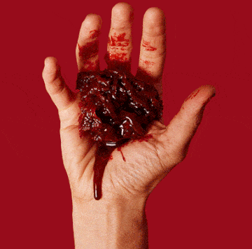 hand with fake blood, guts, and scab