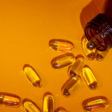 brown bottle of vitamins omega 3 pills