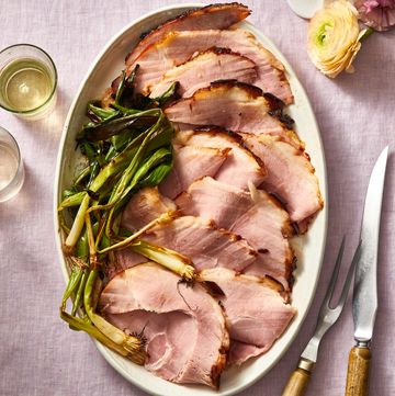 cherry bourbon glazed ham with green onions on the side
