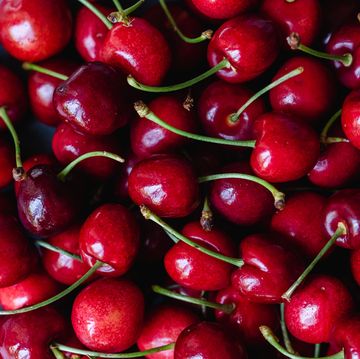 Close up of a bunch of bright red cherries shot from above. close up of a bunch of bright red cherries shot from above