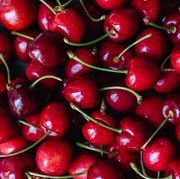 close up of a bunch of bright red cherries shot from above