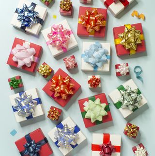 colourful gift boxes on light blue background pattern
