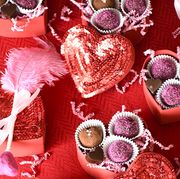 diy valentine gifts, chocolate heart boxes and treat bags with pink mini shovels