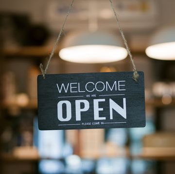 open sign on cafe hang on door at entrance