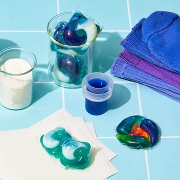 laundry detergents on blue tile background