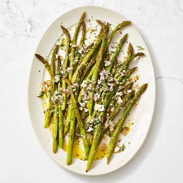 roasted asparagus with feta vinaigrette on a white plate roasted asparagus with feta vinaigrette on a white plate