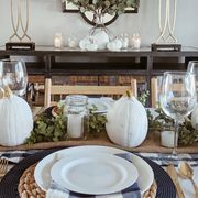 thanksgiving decorations, thanksgiving table setting with pumpkins and greenery