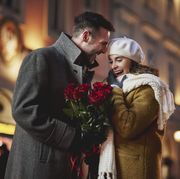 man giving roses to his girlfriend