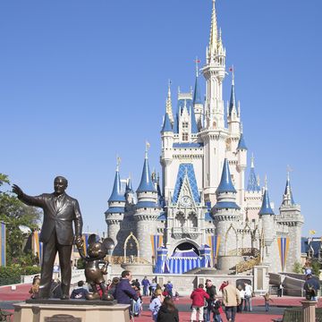 Walt Disney and Mickey Mouse Partners statue and Cinderella Castle, Magic Kingdom, Orlando, Florida, USA walt disney and mickey mouse partners statue and cinderella castle, magic kingdom, orlando, florida, usa