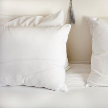 white pillows on bed