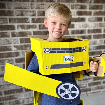 transformers halloween costume ideas , kid dressed in roboto costume, kid wearing yellow boxes